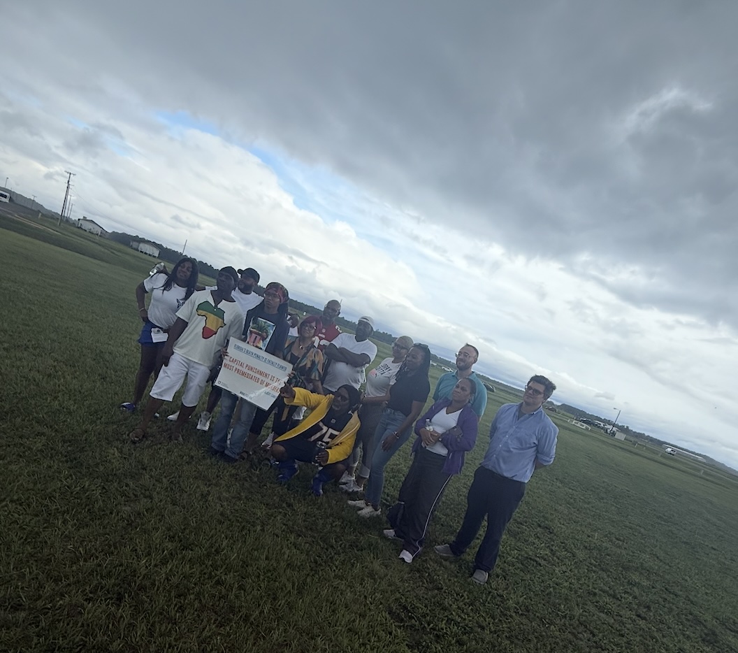 Loved ones of Michael Bell across from Florida State Prison on July 15, 2025